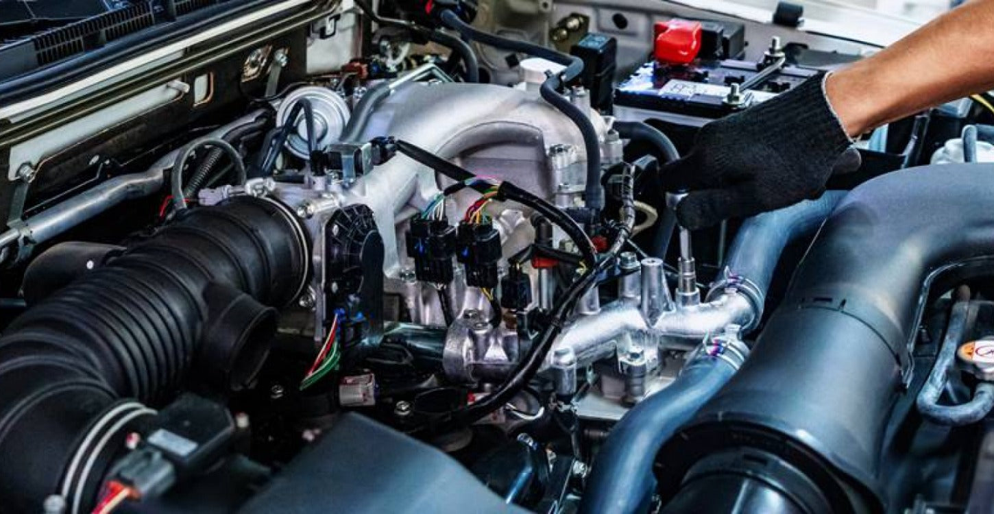 Engine bay showing fuel system components during rough idle and hesitation diagnosis