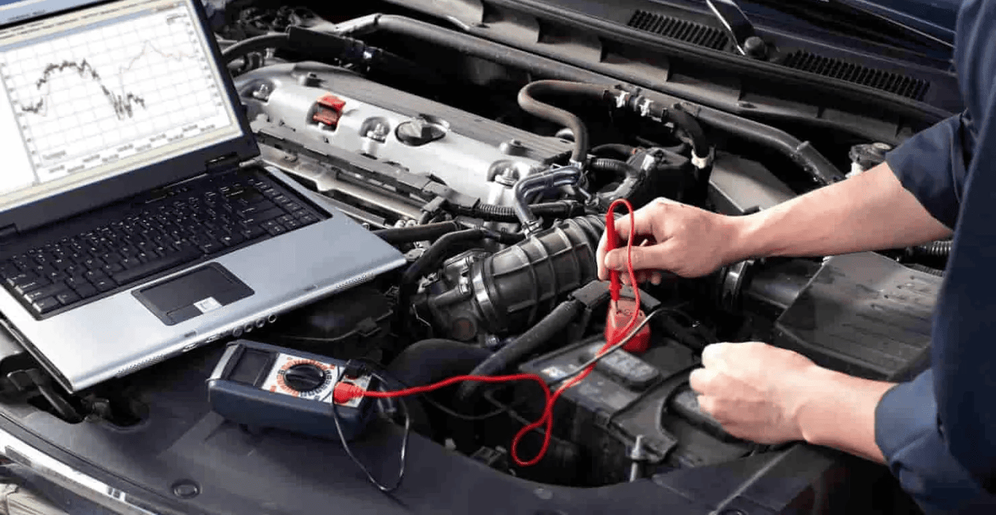 A mechanic diagnosing why a car won’t start using diagnostic tools in the engine bay